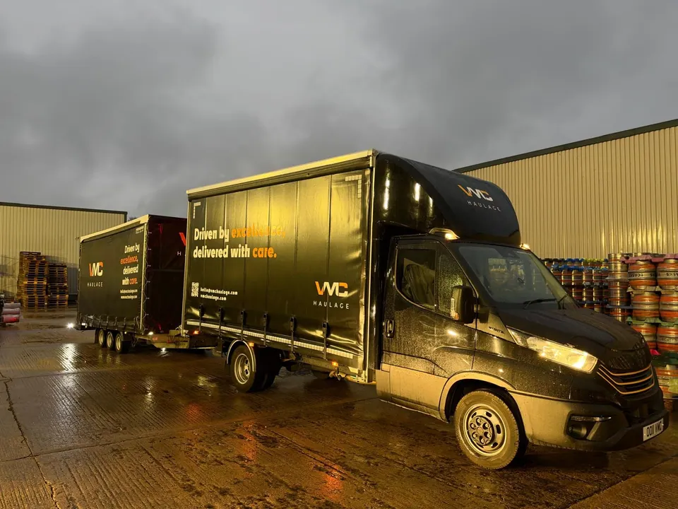 VMC Haulage delivery vehicle and trailer outside the warehouse.